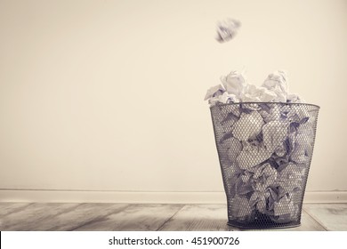 Crumpled paper in the trash can
