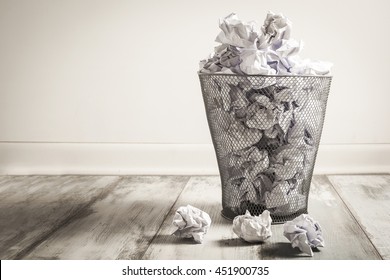 Crumpled Paper In The Trash Can