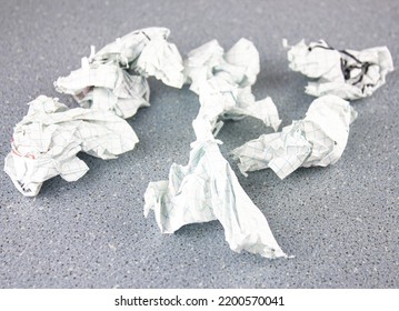 The crumpled pieces paper the table  Errors in work  break   crumple documents  Destruction documents  files 