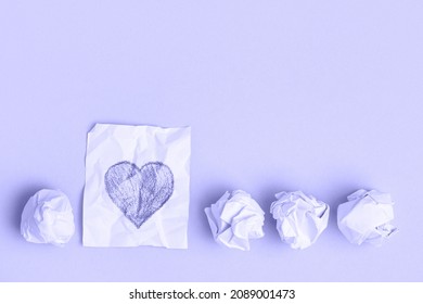 Crumpled pieces white paper   one unfolded  Pencil drawn heart  Progress love  Very peri color 2022 