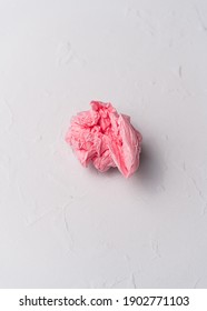 Crumpled Pink Tissue Paper Ball On White Background