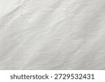 ​White crumpled plastic texture background with subtle woven pattern. Grungy wrinkled synthetic fabric surface, abstract industrial tarp material for overlay or backdrop design.