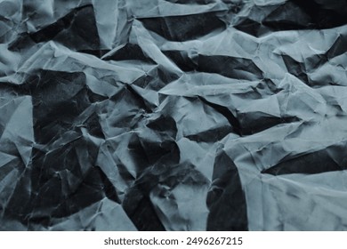 crumpled plastic texture with polygon-like pattern. abstract gray plastic background
