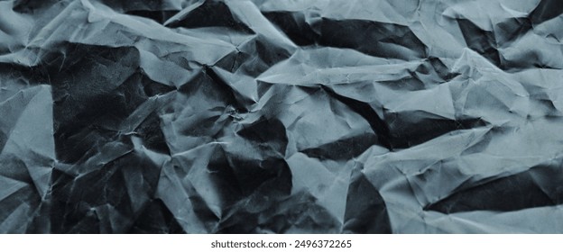 crumpled plastic texture with polygon-like pattern. abstract gray plastic background