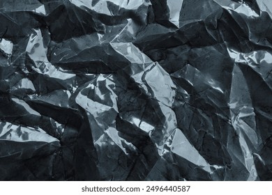 crumpled plastic texture with polygon-like pattern. abstract gray plastic background