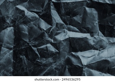 crumpled plastic texture with polygon-like pattern. abstract gray plastic background