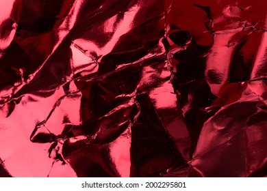 Crumpled Red Foil Paper Texture.