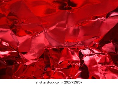 Crumpled Red Foil Paper Texture.