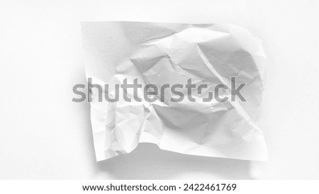 Crumpled sheet of A4 paper on a white background with copy space. Mockup with crumpled sheet of white paper for graphics, words, notes. Crumpled sheet of paper closeup for abstract white background.