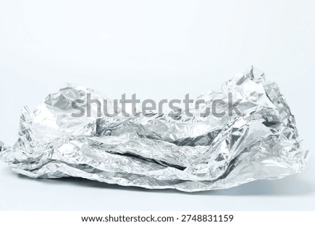crumpled silver foil texture background.
