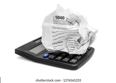 Crumpled Tax Form With Calculator On White.