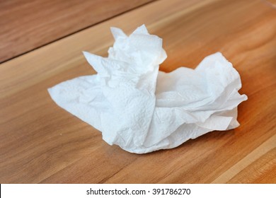 Crumpled Tissue Paper On Wood Table