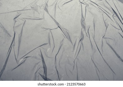 Crumpled transparent plastic film, polyethylene background, crumpled polyethylene, texture polyethylene, grunge background, polyethylene in the air