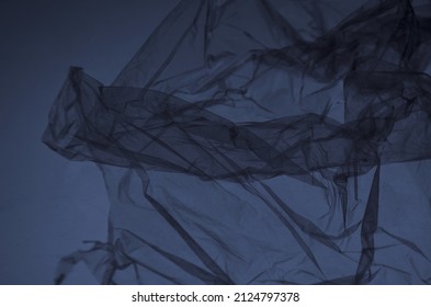 Crumpled transparent plastic film, polyethylene background, crumpled polyethylene, texture polyethylene, grunge background, polyethylene in the air