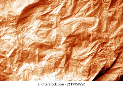 Crumpled white paper background in orange tone. Abstract architectural background and texture for design.