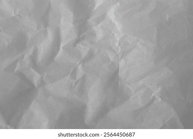 Crumpled white wax paper subtle texture. Wrinkled wrapping paper background. 