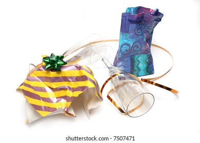 Crumpled wrapping and empty glasses isolated on white