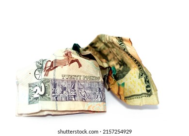 Crumpled  wrinkled American money note of 20 $ twenty dollars bill and 20 LE twenty Egyptian pounds cash banknote isolated on white background, economy inflation and world money crisis concept
