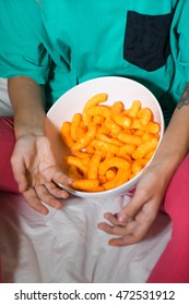 Crunchy Cheese Snacks In The Basket In The Hands Of Women.