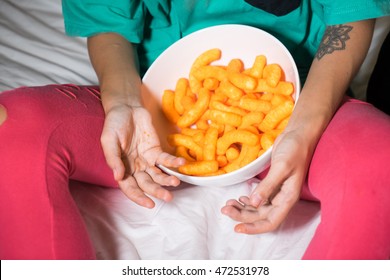 Crunchy Cheese Snacks In The Basket In The Hands Of Women.