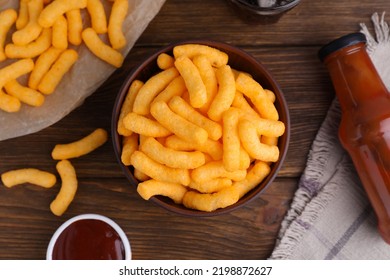 Crunchy Cheesy Corn Snack And Ketchup On Wooden Table, Flat Lay