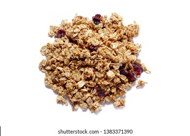 Crunchy granola or muesli scattered, isolated on white, top view. 