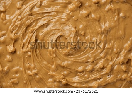 Crunchy peanut butter with pieces of peanuts