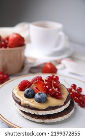 Crunchy Rice Cakes With Peanut Butter And Sweet Berries On Plate