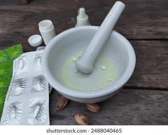 crush the tablet medicine with a porcelain mortar and pestle - Powered by Shutterstock