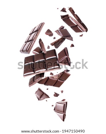Crushed bar of dark chocolate in the air on a white background Foto stock © 
