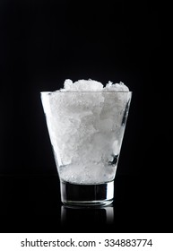 Crushed Ice In Glass On The Black Background