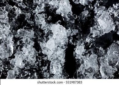 Crushed Ice Pattern On Black Background. Close Up