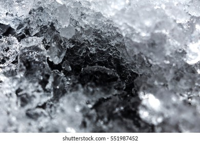 Crushed Ice Pattern On Black Background. Close Up