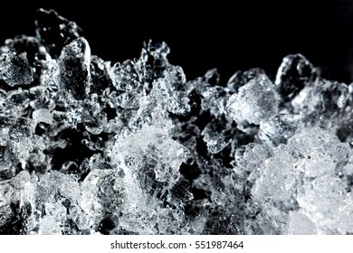 Crushed Ice Pattern On Black Background. Close Up