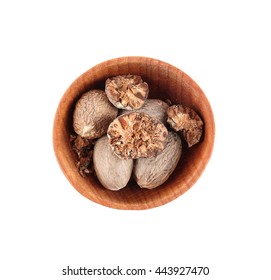 Crushed Nutmeg In Small Wooden Bowl Isolated On White