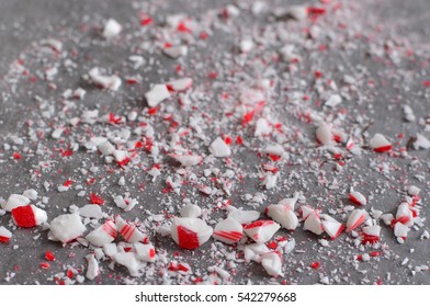 Crushed Peppermint Candy Cane Bits Sprinkled On Wax Paper Background
