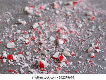 Crushed Peppermint Candy Cane Bits Sprinkled On Wax Paper Background
