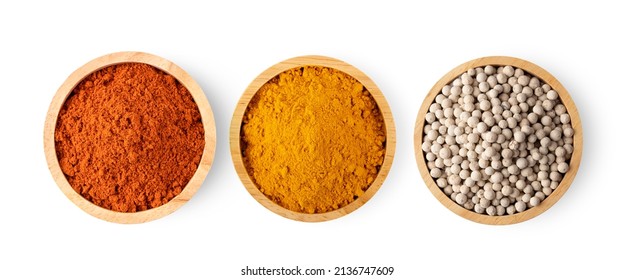 Crushed red chili pepper Turmeric powder in wood bowl isolated on white background. top view - Powered by Shutterstock