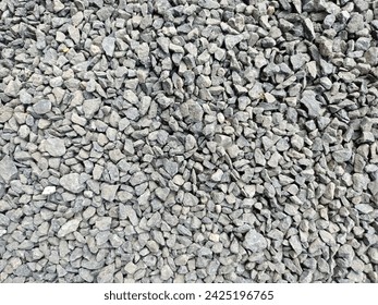 Crushed rock. Small rocks ground. Crushed stone road building material gravel texture. Small stone construction aggregate materi rock. Garden gravel background stone landscaping. Driveway gravel road  - Powered by Shutterstock