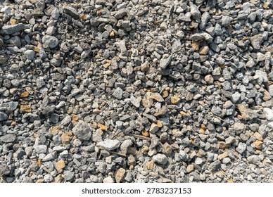 Crushed stone or aggregate. Used to create a stable base layer for projects such as driveways, walkways, and building foundations.
