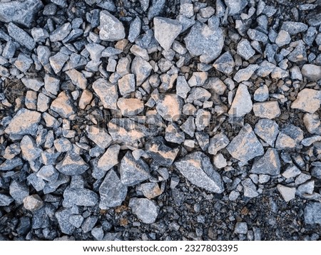 Crushed Stones on the Road. Rock Fragments. Stones Texture Background.