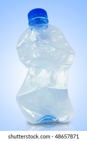 Crushed Water Bottle In Blue Background