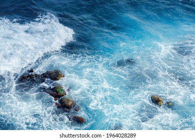 crushing sea waves texture. beautiful nature background view from above. unbelievable blue color of water. few rocks among foam - Powered by Shutterstock