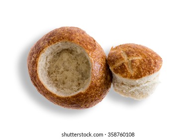 Crusty Fresh Sourdough Roll Prepared As A Bread Bowl For Soup With The Cap Lying Alongside, Overhead View On White With Copy Space