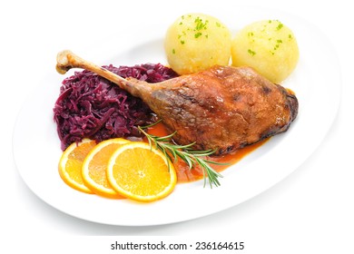 Crusty Goose Leg With Braised Red Cabbage And Dumplings Isolated On White