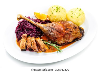 Crusty Goose Leg With Braised Red Cabbage And Dumplings Isolated On White