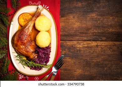 Crusty Goose Leg With Braised Red Cabbage And Dumplings. Cooking At Christmas Time