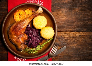 Crusty Goose Leg With Braised Red Cabbage And Dumplings. Cooking At Christmas Time