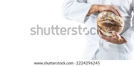A crusty loaf of fresh bread in the baker's hands - isolated on white.