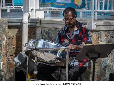 Cruz Bay, St John/ United States Virgin Islands - February, 2010: Islander Playing Steelpan Drums In Park Near Ferry Terminal